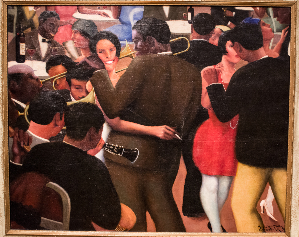 Painting of a lively jazz scene with a couple dancing in a crowded room. Musicians play trumpets and clarinets while people socialize, creating a vibrant atmosphere. *Blues* (1929) by Archibald Motley via [Wikimedia](https://en.wikipedia.org/wiki/Archibald_Motley#/media/File:Blues_-_Archibald_Motley_Jr_(25844028778).jpg)