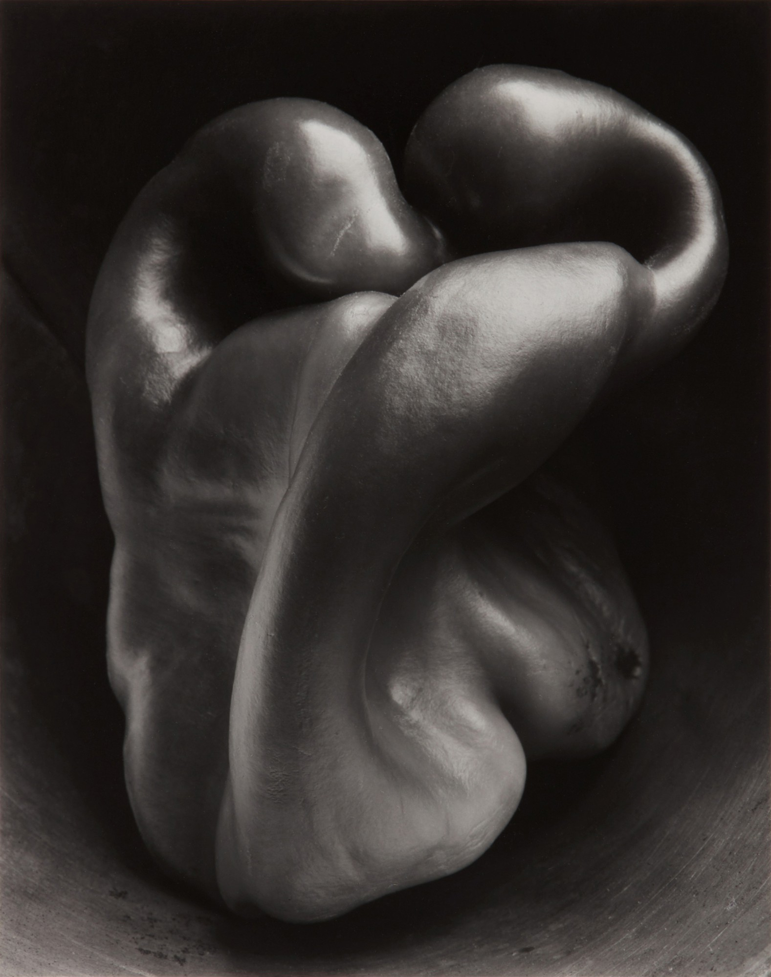 A black and white close-up photo of an intricately curved bell pepper with smooth, glossy surfaces and dramatic lighting emphasizing its organic form. *Pepper No. 30* (1930) by Edward Weston; posthumous print by his son Cole Weston via [Wikimedia](https://commons.wikimedia.org/w/index.php?curid=123637244)